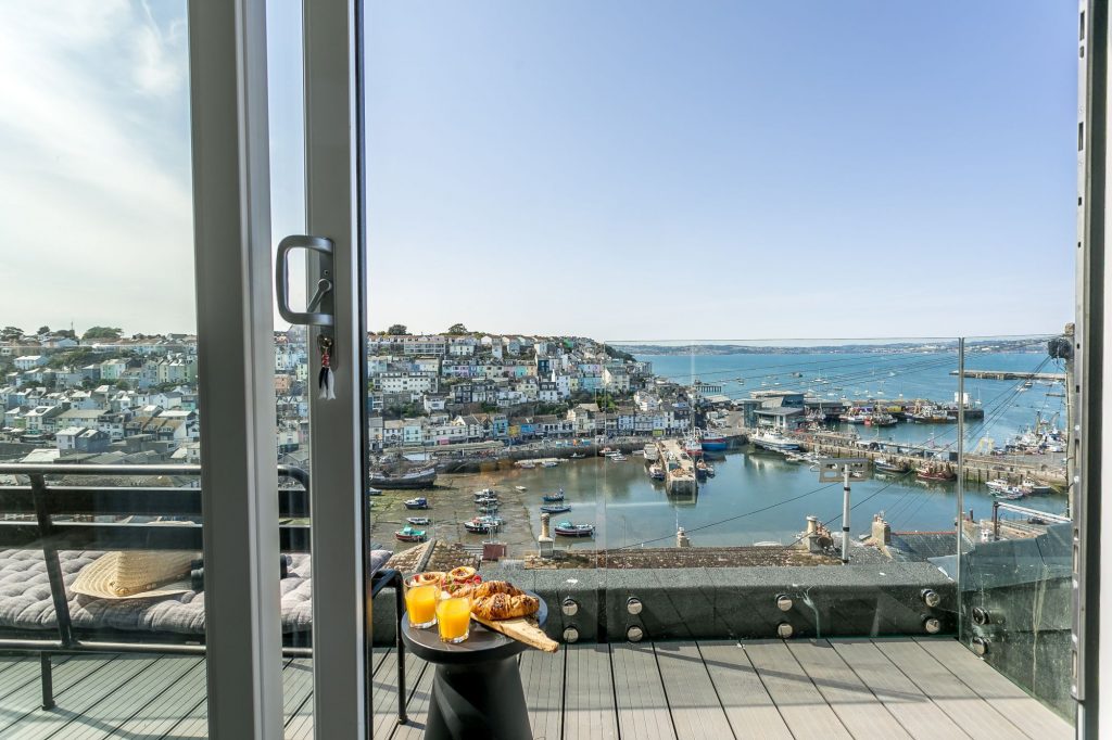 Full height patio door opening onto a balcony with THIS view? Make sure you grab the master bedroom for yourself at the Captains Cottage Brixham